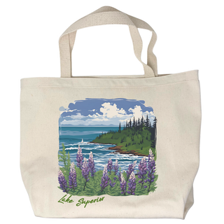 USA-Made in Washburn, Wisconsin with 100% cotton canvas. This unique tote bag features a fun graphic designed in-house. Perfect for carrying your essentials on any adventure! Features a lake shoreline with lupines blooming in the foreground and trees and clouds in the distance.