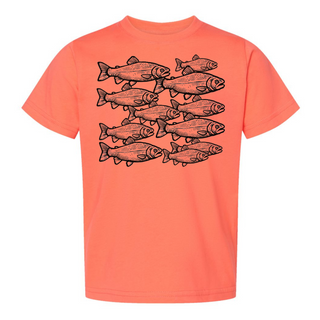 Papaya-colored kid t-shirt with a graphic of a school of fish, designed and heat-pressed by AdventureUs in Washburn WI
