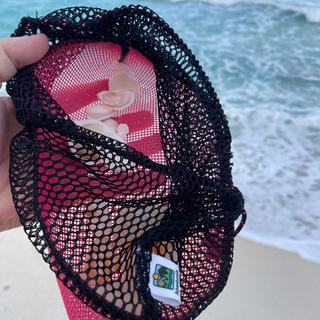 This drawstring mesh bag is the perfect accessory for all your nature walks, whether you're beachcombing or hiking in the woods. Great for rock hunting, foraging, beach glass collecting, sea shells, pinecones, and as a beachcomber tote. Drawstring, toggle closure with durable mesh and a fine weave bottom to keep your treasures in but let sand out. Main body mesh is made using eco-friendly remnant fabric. Made in Wisconsin, USA