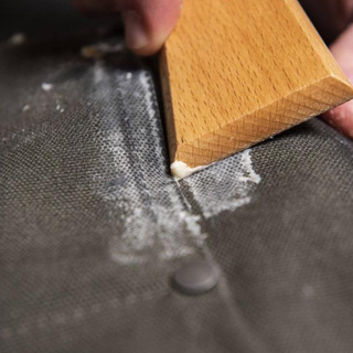 This is a great tool to have on hand when waxing up your fabrics.  Once wax has been applied to the fabric, use the flat side of the tool to help press the wax deeper into the fabric to help create a better seal. The pointed edges of the tool can be used to remove any excess wax that may have accumulated in seams.