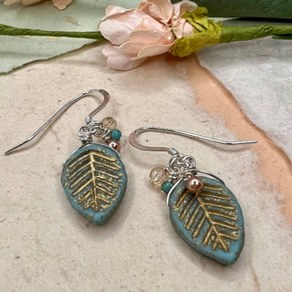 Inspired by the Carolinas- rose gold with minty green, for a peachy coastal feel. Limited Edition!

Crystal pearls and glass&nbsp;

Sterling silver hooks

Local Artist