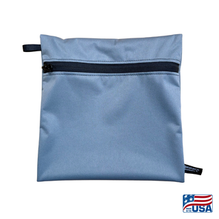 Eco-friendly, water-resistant pack bags keep messes contained and gear organized. Perfect for travel, wet swimsuits, toiletries, or hiking essentials, they make sustainable living simple and stylish. USA Made in Wisconsin with USA eco-friendly fabric.  Color Grey. Size medium 9 inches wide by 9 inches tall.