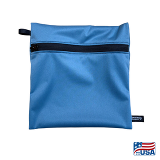 Eco-friendly, water-resistant pack bags keep messes contained and gear organized. Perfect for travel, wet swimsuits, toiletries, or hiking essentials, they make sustainable living simple and stylish. USA Made in Wisconsin with USA eco-friendly fabric.  Color Soft Blue. Size medium 9 inches wide by 9 inches tall.