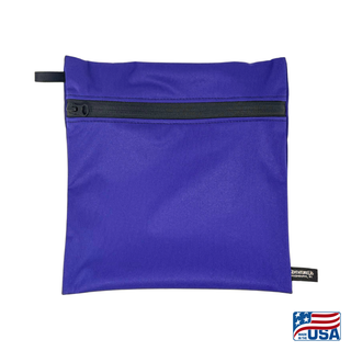 Eco-friendly, water-resistant pack bags keep messes contained and gear organized. Perfect for travel, wet swimsuits, toiletries, or hiking essentials, they make sustainable living simple and stylish. USA Made in Wisconsin with USA eco-friendly fabric.  Color Violet. Size medium 9 inches wide by 9 inches tall.