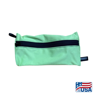 Eco-friendly, water-resistant pack bags keep messes contained and gear organized. Perfect for travel, wet swimsuits, toiletries, or hiking essentials, they make sustainable living simple and stylish. USA Made in Wisconsin. Light Green color with black zipper and hang loop. Size Small 9 inches by 4.5 inches.