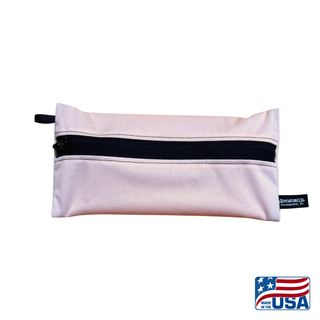 Eco-friendly, water-resistant pack bags keep messes contained and gear organized. Perfect for travel, wet swimsuits, toiletries, or hiking essentials, they make sustainable living simple and stylish. USA Made in Wisconsin. Pale Pink color with black zipper and hang loop. Size Small 9 inches by 4.5 inches.