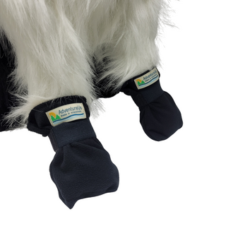 Cozy fleece booties with soft elastic for a gentle, secure fit. Soft fleece fabric for warmth and coziness. Ideal for cold weather or to protect paw injuries. For a durable layer that's perfect for wet, muddy or rough ground try our Rugged Pet Booties. Made by AdventureUs in Washburn, WI Color: Black Shown