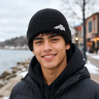 Man outside wearing an organic cotton knit hat featuring a Lake Superior embroidered patch designed and applied by AdventureUs in Washburn Wisconsin.