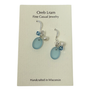 Tumbled matte aqua blue glass creates a soft contrast to the satin finish of Freshwater Pearls.

Sterling silver hooks

Aquamarine blue high quality Crystal

Local Artist&nbsp;