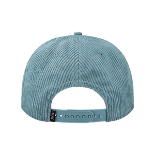 Snap back closure on a blue corduroy trucker hat.