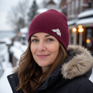 Woman outside wearing an organic cotton knit hat featuring a Lake Superior embroidered patch designed and applied by AdventureUs in Washburn Wisconsin.