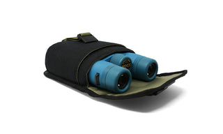Built for longer looks and bigger glass, the Field Issue Binocular Pouch is purpose-built to protect your Field Issue 32mm Binoculars while staying flexible enough for everyday carry and travel.

Made from rugged recycled fabric, this pouch features NocLoc universal strap connectors, a secure closure, and an internal pocket for field notes. Whether worn cross-body, slung over a shoulder, or mounted to your pack or bike, it integrates seamlessly into the NocLoc carry system.