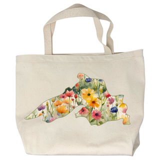 USA-Made in Washburn, Wisconsin with 100% cotton canvas. This unique tote bag features a fun graphic designed in-house. Perfect for carrying your essentials on any adventure! Features watercolor flowers in pink, purple, yellow and green filling the shape of Lake Superior.