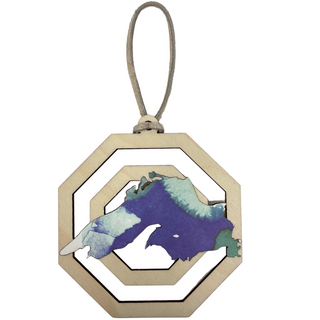 Each piece showcases unique patterns making it a one-of-a-kind addition to your holiday decor. Hang it on your tree or display it in your home to celebrate the season with a touch of nature’s artistry. Perfect as a gift or a cherished keepsake, this ornament captures the spirit of the holidays and the timeless beauty of Lake Superior.

Laser cut birch wood, measures about 3.75 in wide x 4 in tall, is strung with white leather string and packaged in a cellophane bag with backing card.&nbsp;