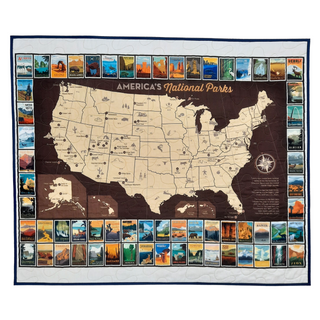 Commemorate your love of the National Parks with this handmade quilted wall hanging. The intricate design is crafted to last, becoming a timeless addition to any home decor or as a treasured gift.   Easily commemorate your travels with additional hand-stitching or pins.  This panel features a map of the national parks in the United States of America bordered by national park posters. Made in Wisconsin, USA by AdventureUs