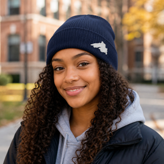 Woman outside wearing an organic cotton knit hat featuring a Lake Superior embroidered patch designed and applied by AdventureUs in Washburn Wisconsin.