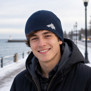 Man outside wearing an organic cotton knit hat featuring a Lake Superior embroidered patch designed and applied by AdventureUs in Washburn Wisconsin.
