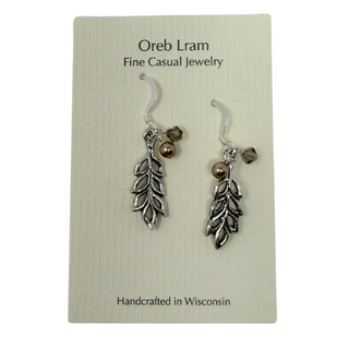 Light and airy, long graceful pewter leaves with bronzy tan high quality pearl crystals and gray crystals.&nbsp;&nbsp;

Sterling silver hooks.

Local Artist