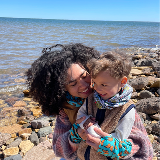 Adult and child by a chilly Lake Superior wearing Thermal Snow Sleeves and Neck Gaiters by AdventureUs.