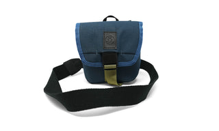 Built for longer looks and bigger glass, the Field Issue Binocular Pouch is purpose-built to protect your Field Issue 32mm Binoculars while staying flexible enough for everyday carry and travel.

Made from rugged recycled fabric, this pouch features NocLoc universal strap connectors, a secure closure, and an internal pocket for field notes. Whether worn cross-body, slung over a shoulder, or mounted to your pack or bike, it integrates seamlessly into the NocLoc carry system.