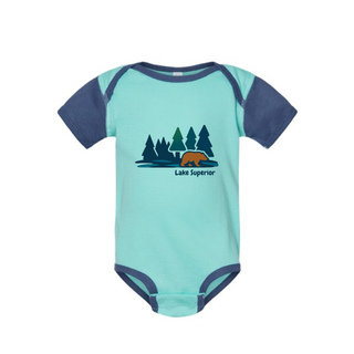 AdventureUs Lake Superior graphic featuring a bear in the woods on a two tone blue baby bodysuit.