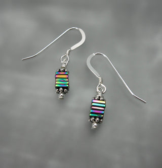 Stacked Titanium Hematite displaying varying metallic tones. Petite and beautiful!

Sterling Silver French Wire Hooks

Titanium Hematite

Local Artist: Ashland, WI