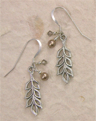 Light and airy, long graceful pewter leaves with bronzy tan high quality pearl crystals and gray crystals.&nbsp;&nbsp;

Sterling silver hooks.

Local Artist