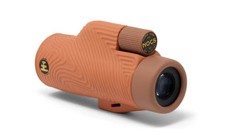 Brown monocular with 'Nocs' branding on a white background
