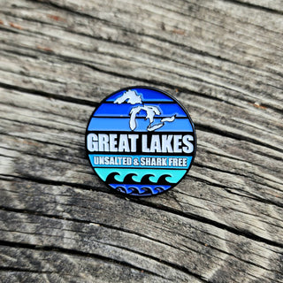 Great Lakes - Unsalted, Shark Free This beautifully crafted accessory captures the lake’s unique shape and striking beauty. Perfect for jackets, bags, or hats, it’s a great way to express your admiration for one of the Great Lakes.