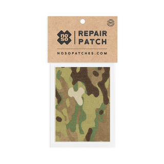 Camouflage repair patch in a clear plastic sleeve with a brown cardboard backing, featuring 'no so' branding.