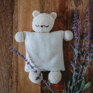 This soft and cuddly organic cotton bear makes the perfect gift. Can be warmed or cooled for a soothing snuggle buddy Designed and made in Bayfield, WI USA Beautifully Handcrafted Heirloom Baby Toy Certified Organic Cotton Terry Cloth This original handmade bear will become a beloved companion to soothe you and your child to sleep. Filled with flax seed and lavender buds, this bear will provide a warm snuggle with a soothing scent.